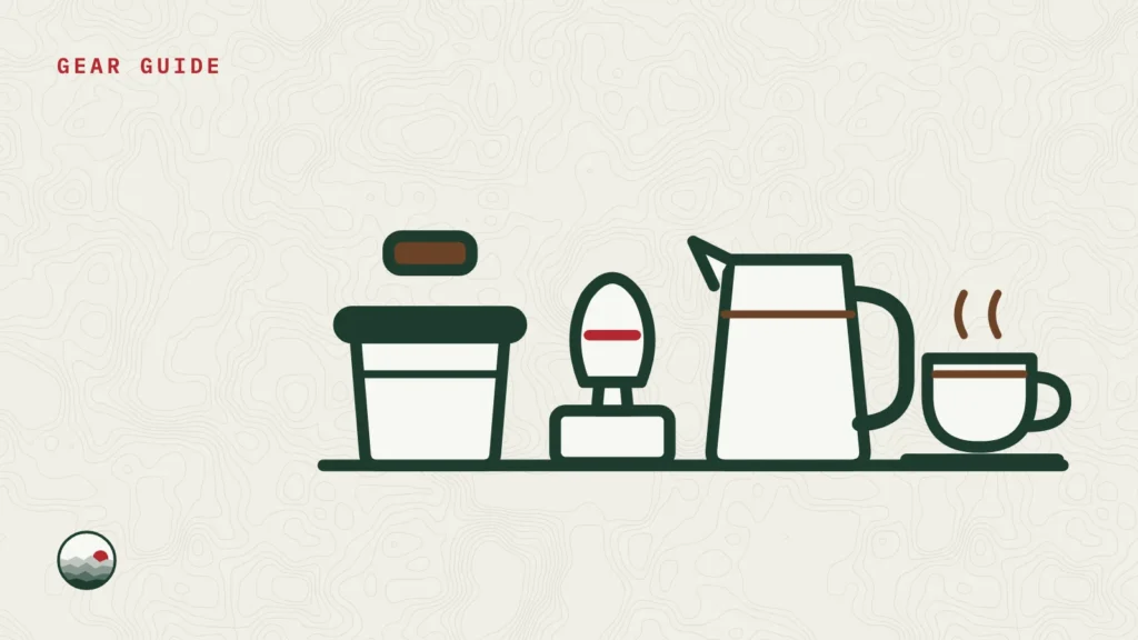 Illustration of an espresso tamper, a milk pitcher, a knock box and an espresso cup on a counter